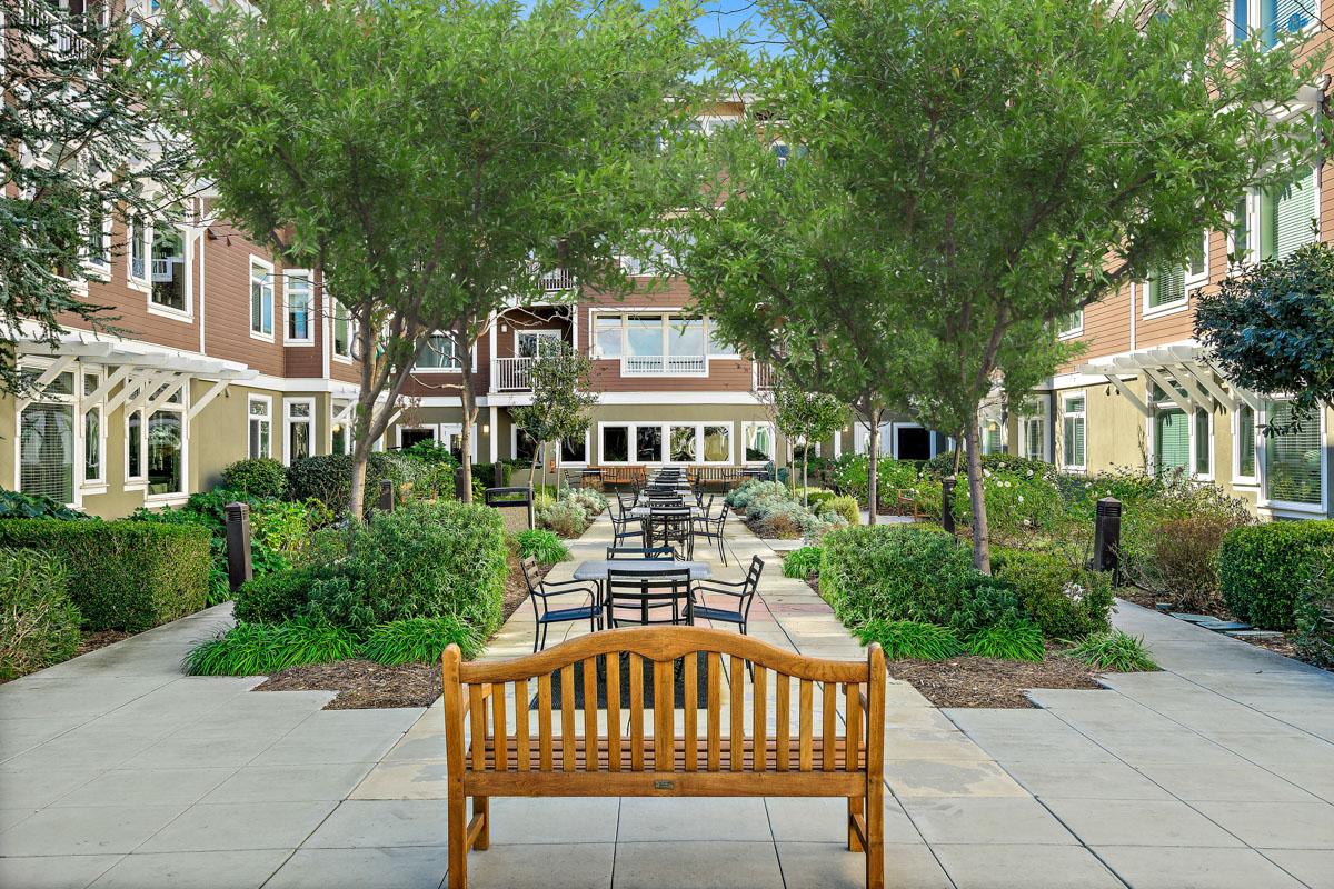 University Retirement Community exterior view of housing and seating